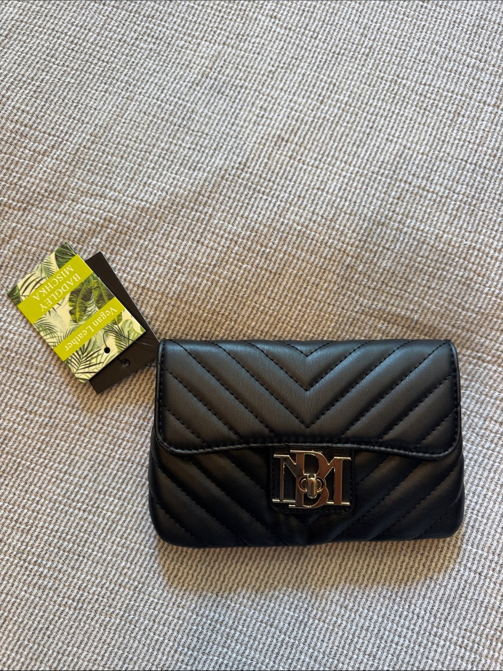 Black Quilted Chevron Crossbody Bag with Metallic Logo Accent